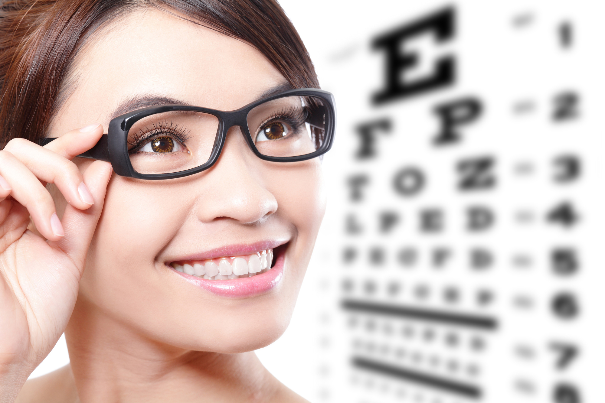 Woman with Glasses and an Eye Chart