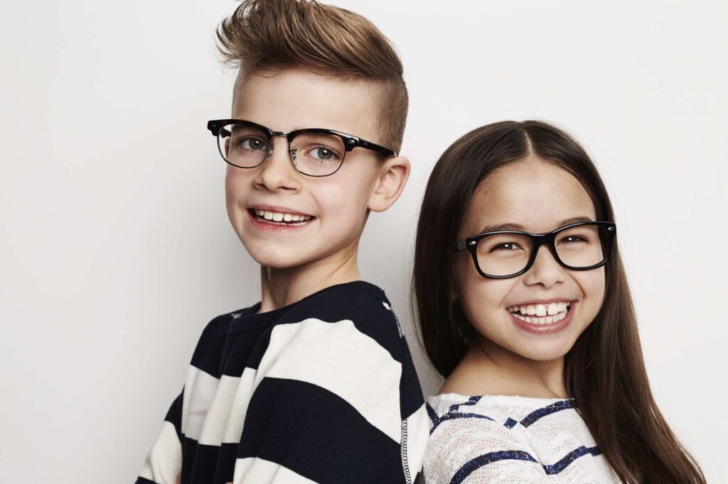 Happy kids with prescription glasses